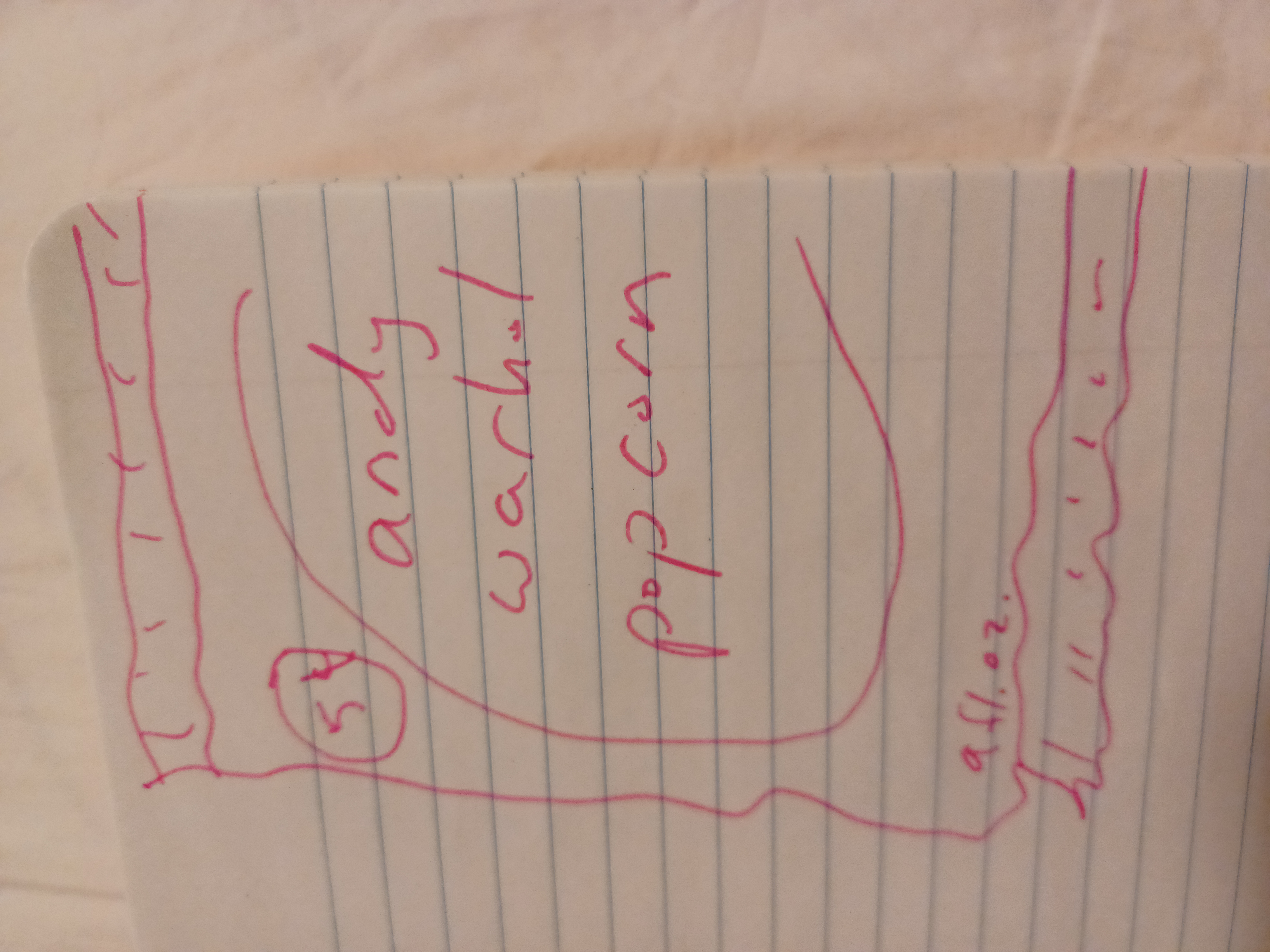 a photo of a notebook with a marker drawing of a popcorn bag with 'andy warhol popcorn' written on it as the brand